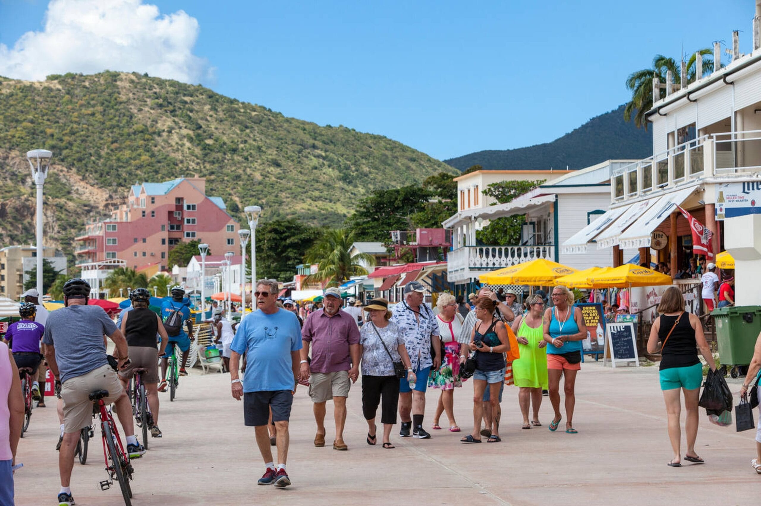 Professional St. Maarten taxi and transfer service for airport, cruise port, and hotel arrivals. Tour group visiting a local market in St. Maarten