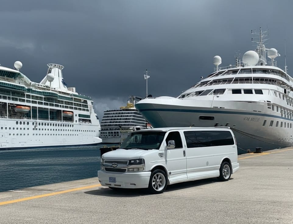 Professional St. Maarten taxi and transfer service for airport, cruise port, and hotel arrivals. Speks Transportation van beside cruise ships in St. Maarten